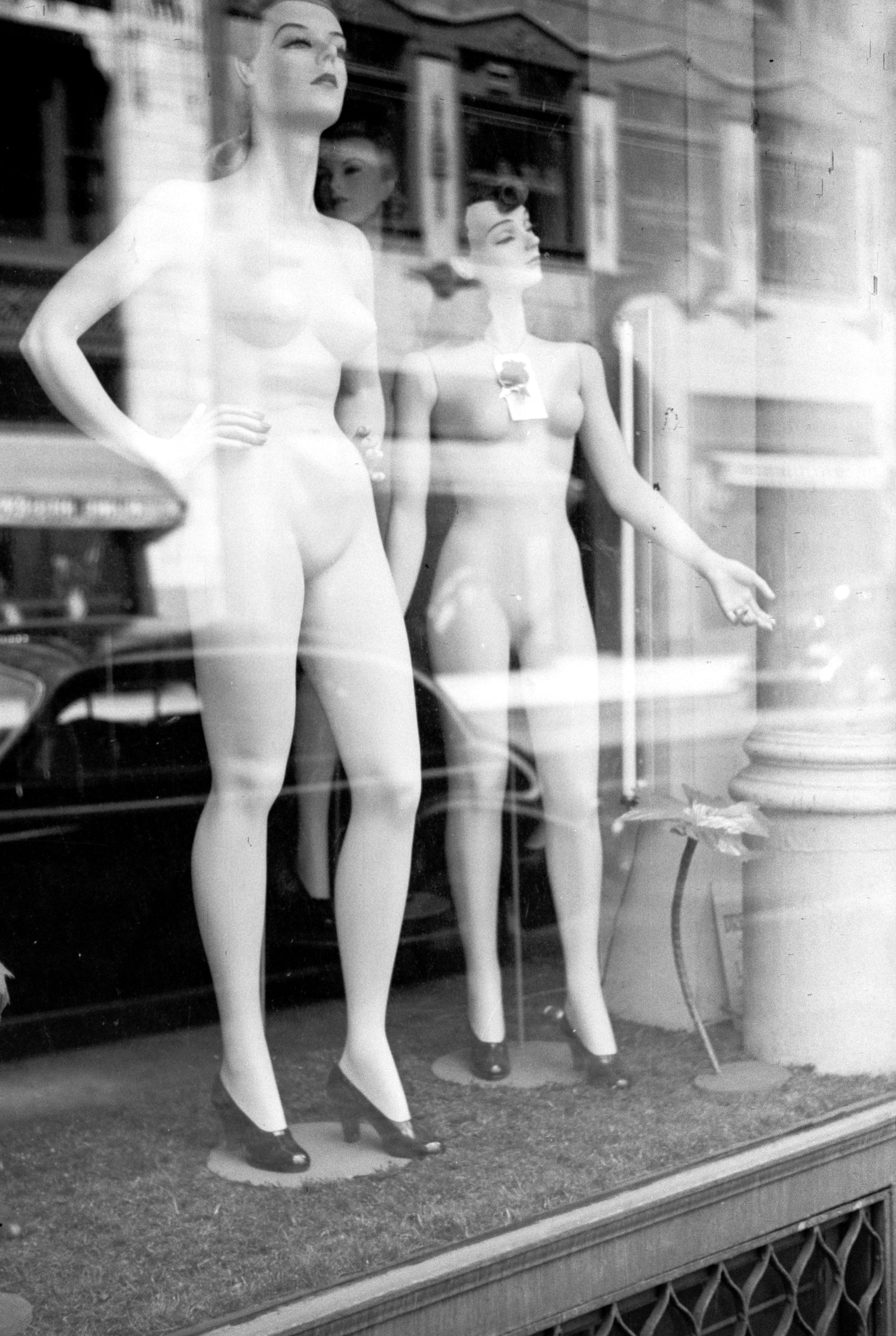 Mannequins in a department store window.